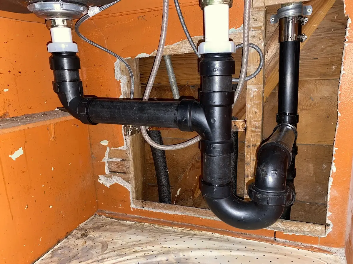 Professional Garbage Disposal Repair equipment and tools on the job in Fairview